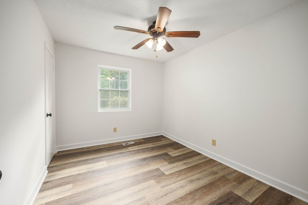 246 Sunnyside Church Road Pine Mountain, GA 31822 - Photo 16 of 26 an empty room with a window and a fan