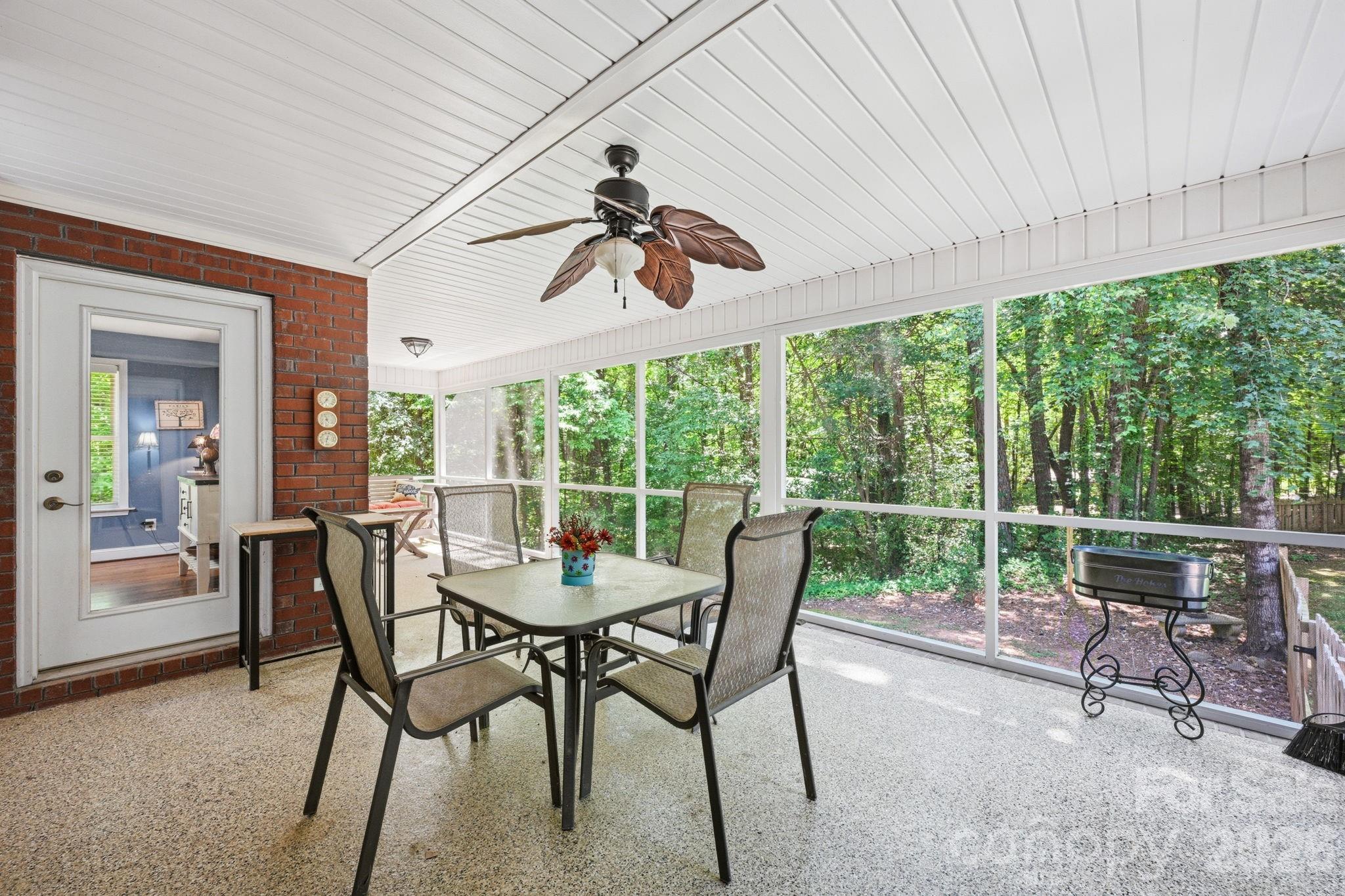 145 Upper Spencer Mountain Road Stanley, NC 28164 - Photo 18 of 29 a dining room with furniture water view and a floor to ceiling window