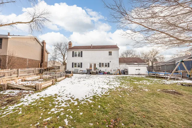 a view of a house with snow on the background