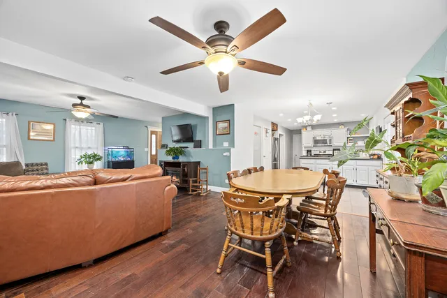 a dining room with furniture and window
