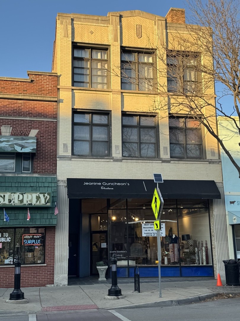 a view of a building with sitting area