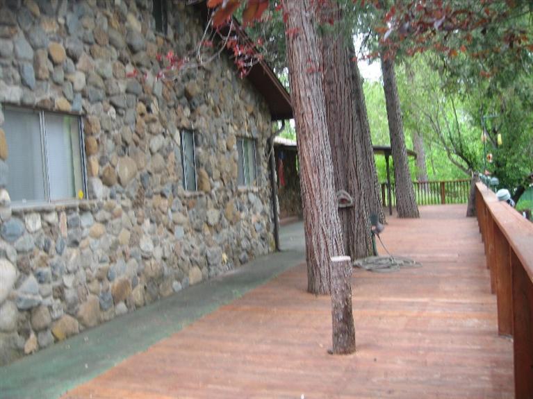 4988 Holland Loop Road Cave Junction, OR 97523 - Photo 10 of 35 a view of a pathway of a house