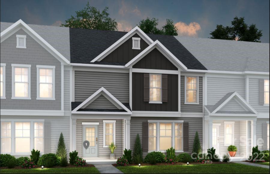 22051 Lani Drive, Unit 17 Charlotte, NC 28273 - Photo 1 of 19 a front view of a house with a yard