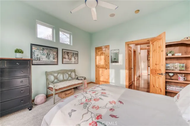 a bedroom with furniture and a dresser
