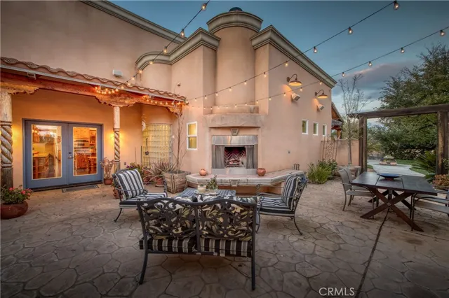 a view of a patio with a table and chairs
