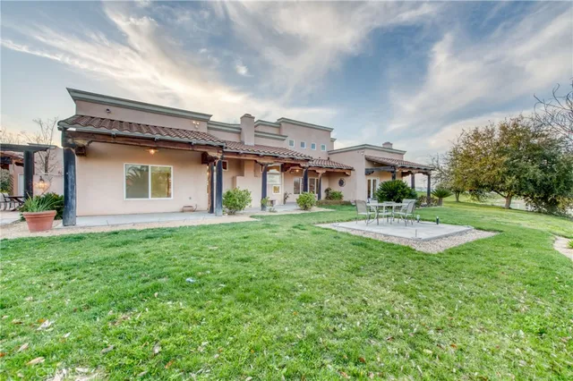 a view of a swimming pool with a patio