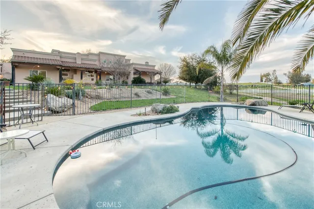 a view of a patio with a table and chairs