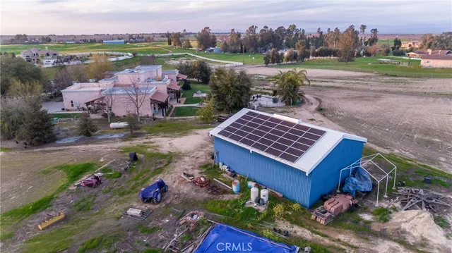 an aerial view of residential house with outdoor space and parking