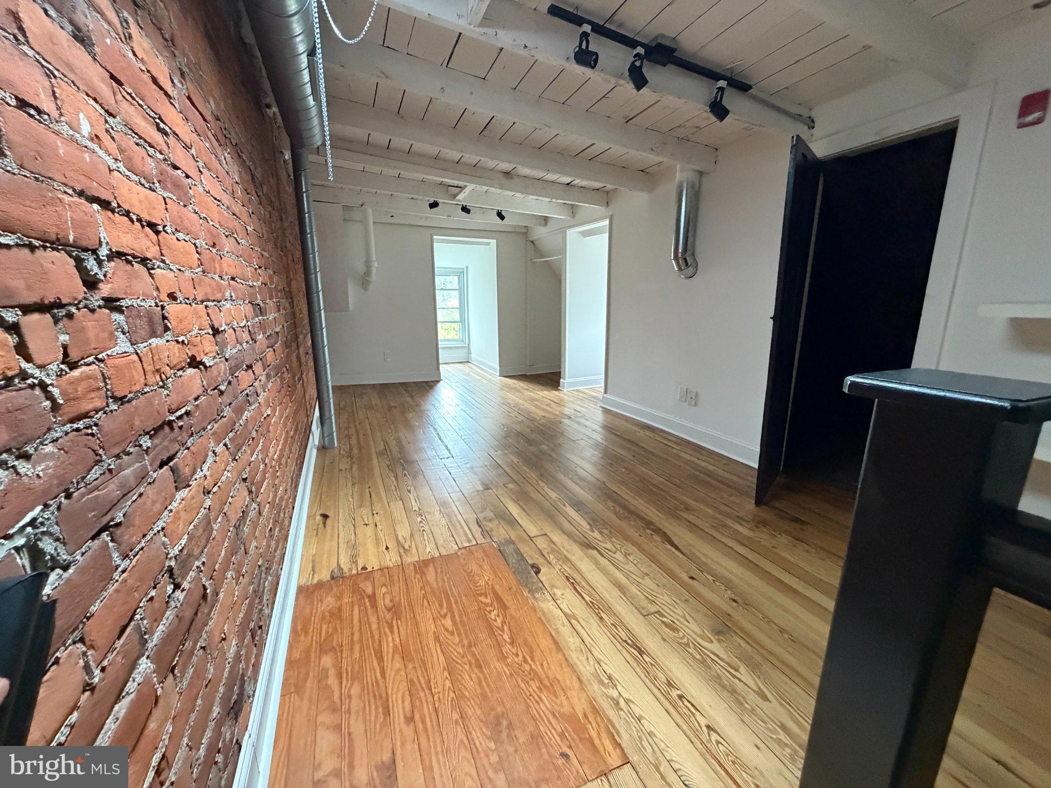 815 South 49th Street Philadelphia, PA 19143 - Photo 48 of 72 a view of wooden floor in a hall with wooden floor