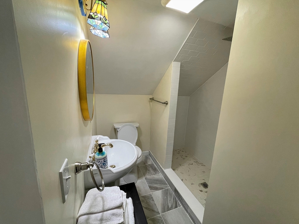 8 Pike Street Hopkinton, MA 01748 - Photo 16 of 34 a bathroom with a sink and mirror