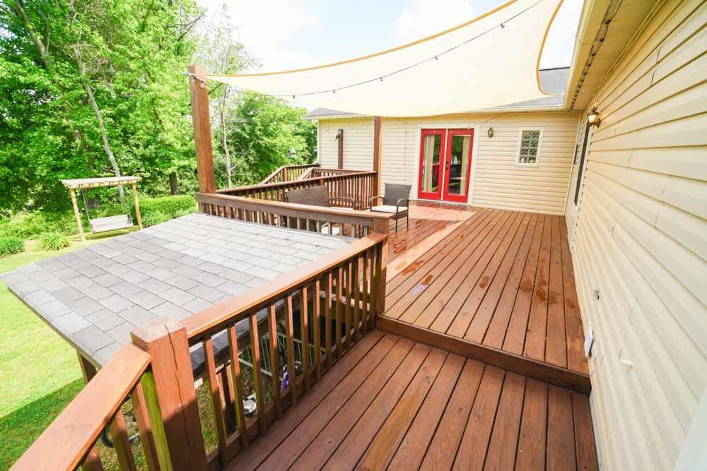 512 Jim McKenzie Road Brighton, TN 38011 - Photo 16 of 20 Many an enjoyable evening can be spent outside after a hard day on your beautiful deck. The deck opens up off the master suite through french doors, or from the kitchen area. Off the deck is an area for storage! Well thought out property to be sure.