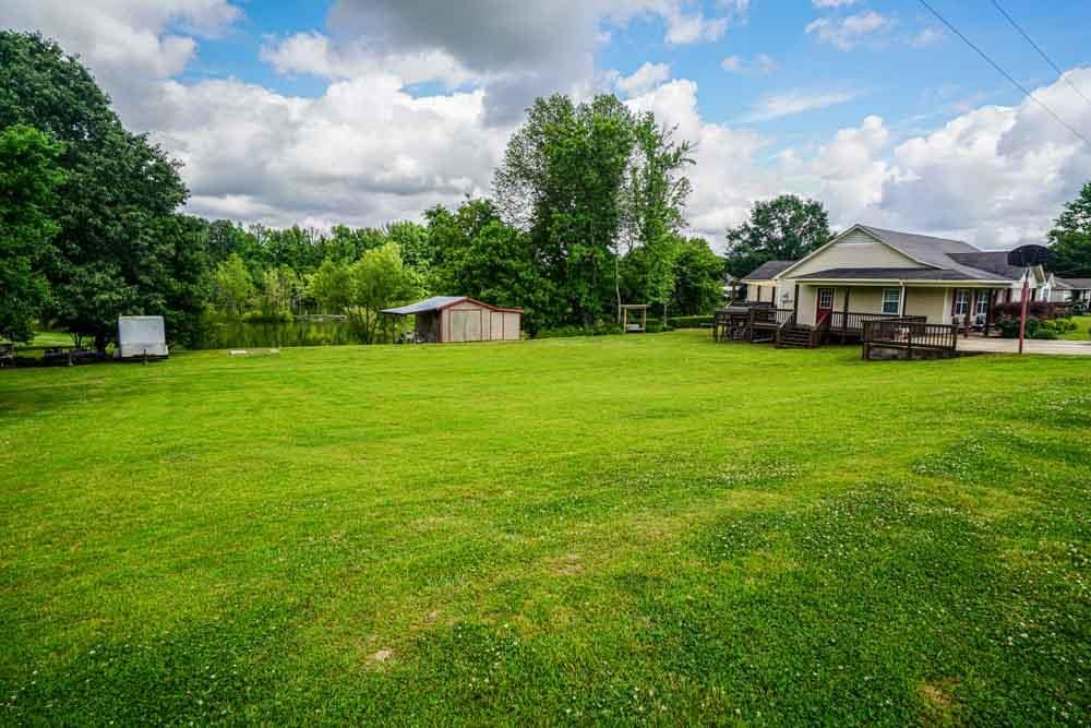 512 Jim McKenzie Road Brighton, TN 38011 - Photo 18 of 20 With this home comes so much outdoor space for all your family functions or entertaining needs. Situated on 1.05 acres this property has a shop with concrete floors and electricity. Plus an extra storage shed.