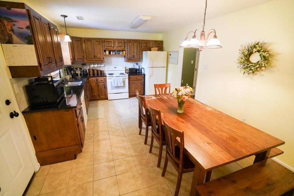 512 Jim McKenzie Road Brighton, TN 38011 - Photo 3 of 20 This kitchen is so functional and boasts great light along with the beautiful dark cabinetry. Separate laundry room and mud room off the side, plus the amazing deck is right outside your kitchen.