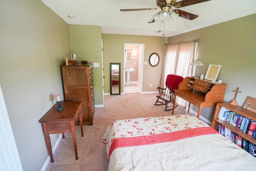 512 Jim McKenzie Road Brighton, TN 38011 - Photo 5 of 20 Your oasis after a hard days work. Recline here with views of the flowers and the pond; slip into your own updated adorable bathroom or step out your french doors onto your beautiful deck to enjoy the fresh air.