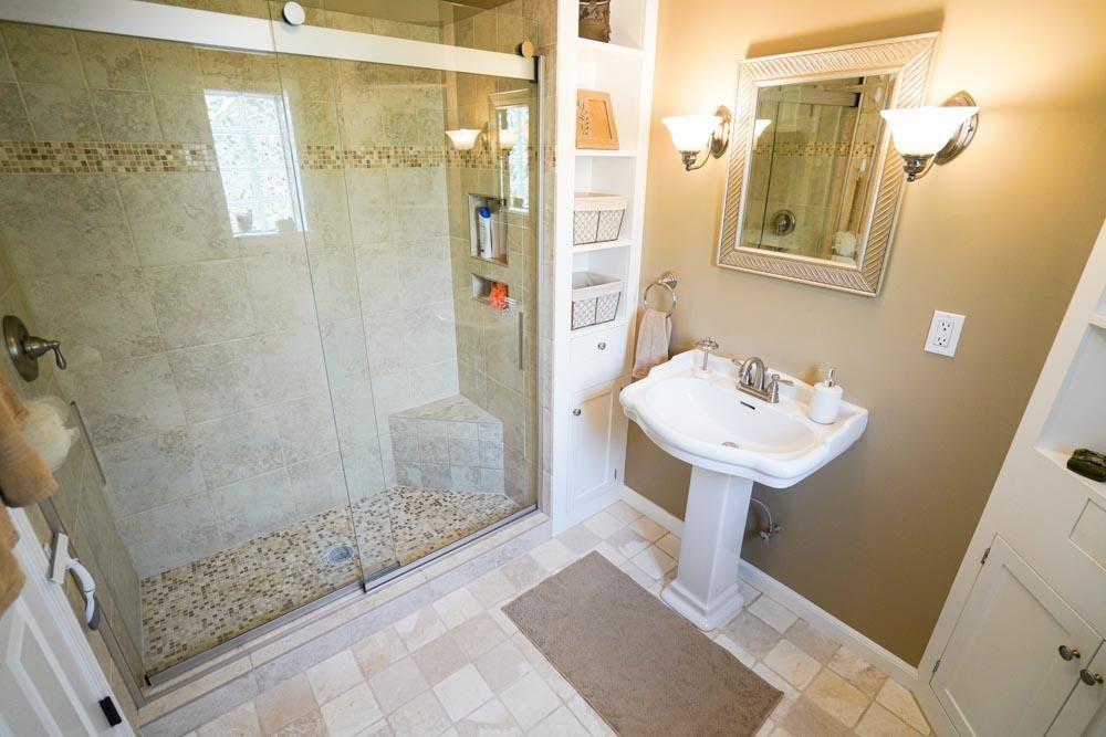 512 Jim McKenzie Road Brighton, TN 38011 - Photo 6 of 20 Can you believe this beautiful shower? Enjoy the beautiful built ins which make for great use of space in your personal bathroom.