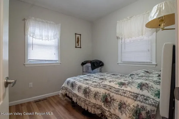 a bathroom with a sink a toilet and shower curtain