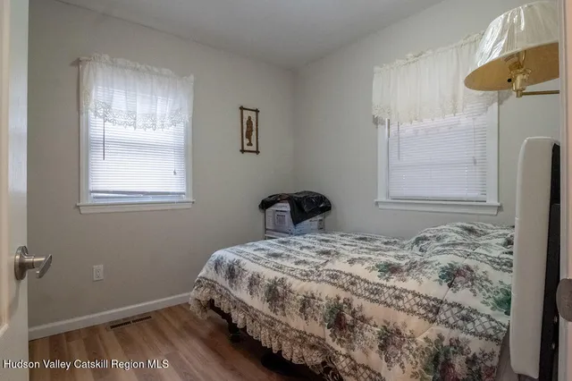 a bathroom with a sink a toilet and shower curtain