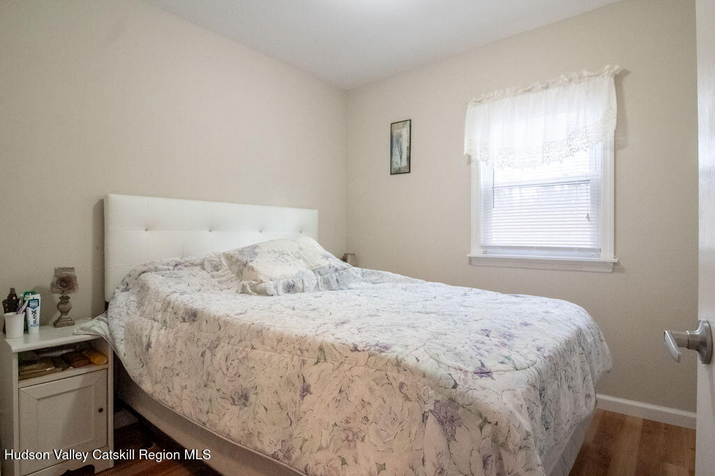 224 Camp Road Ellenville, NY 12428 - Photo 17 of 50 a large bed sitting in a bedroom next to a window