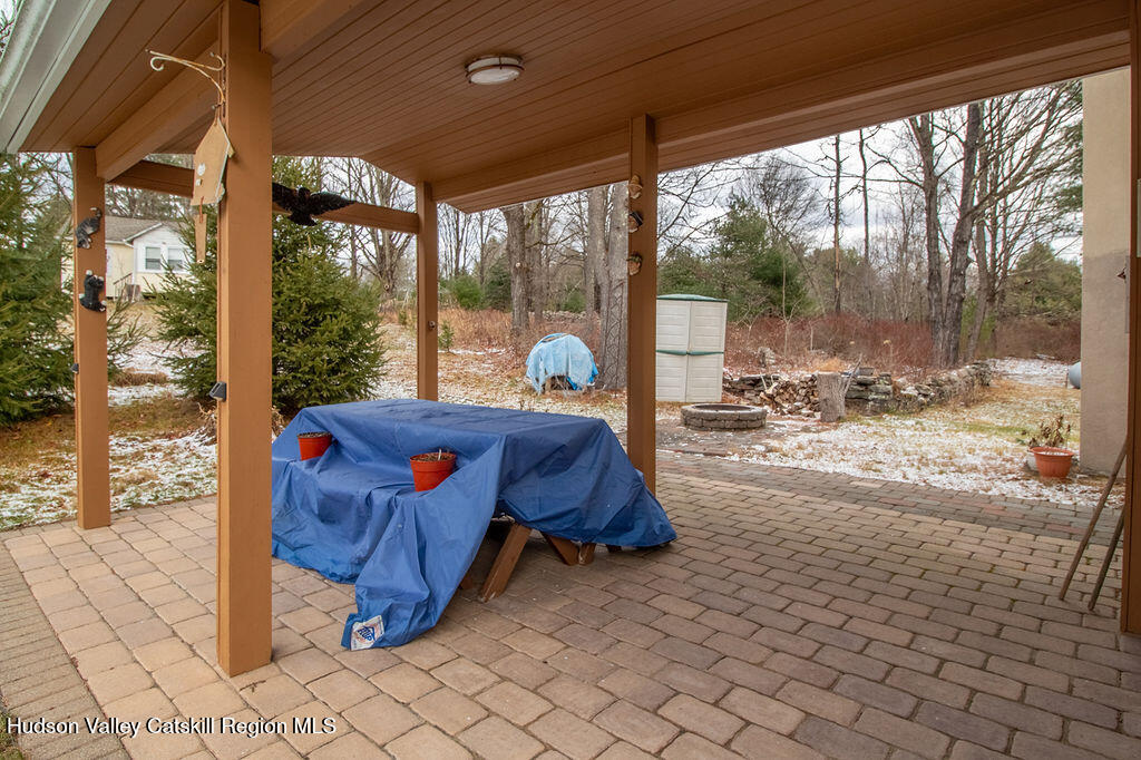 224 Camp Road Ellenville, NY 12428 - Photo 19 of 50 a bedroom with a bed and large windows