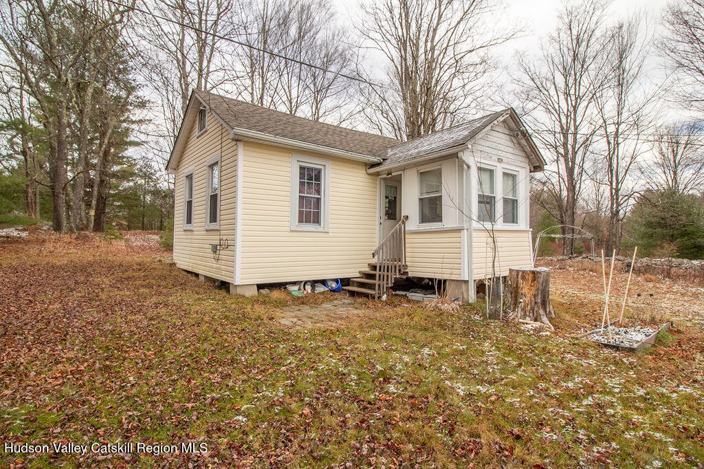 224 Camp Road Ellenville, NY 12428 - Photo 20 of 50 a backyard of a house with table and chairs
