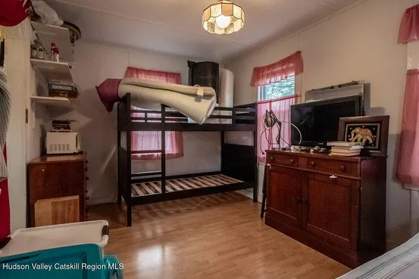a view of a dining room with furniture and windows