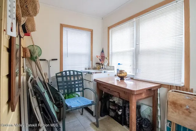 a bedroom with a bed and a tv