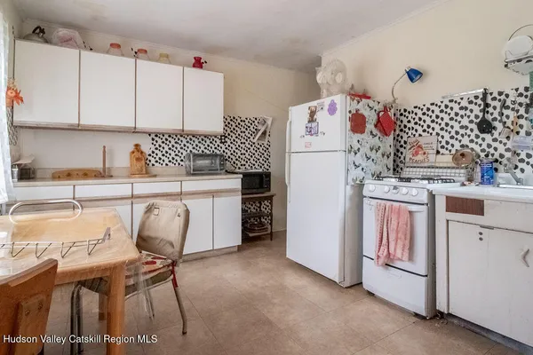 a bedroom with two beds and a window