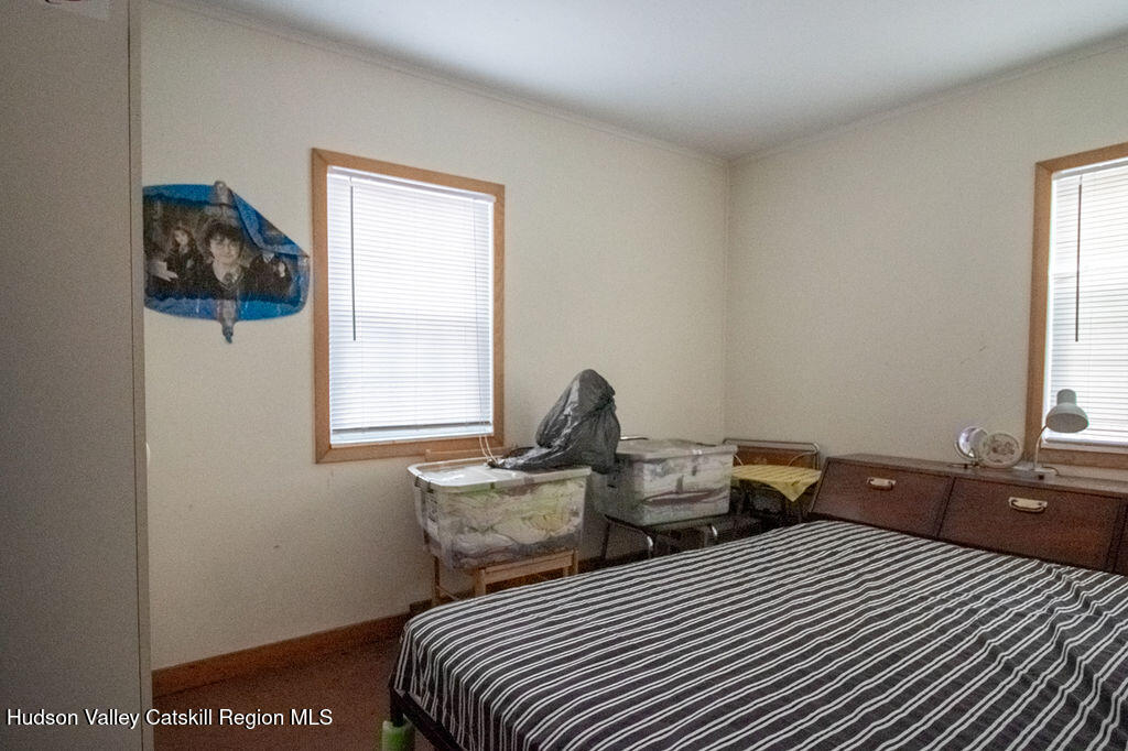 224 Camp Road Ellenville, NY 12428 - Photo 42 of 50 a bedroom with two beds and a window