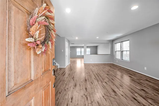 a view of entryway and wooden floor