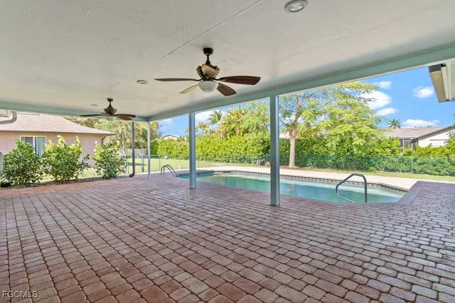 a view of a swimming pool with a yard