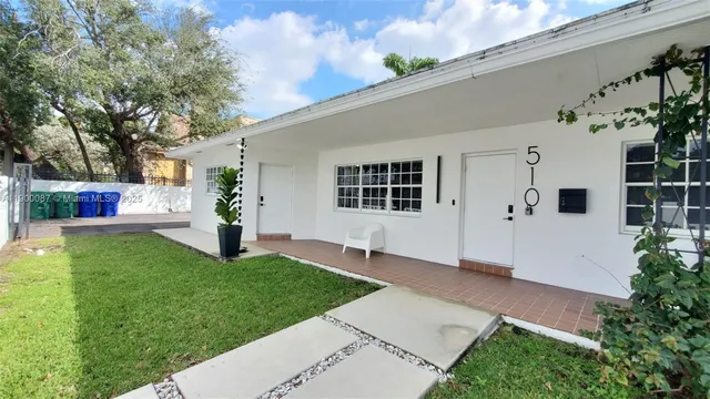 a house view with a garden space