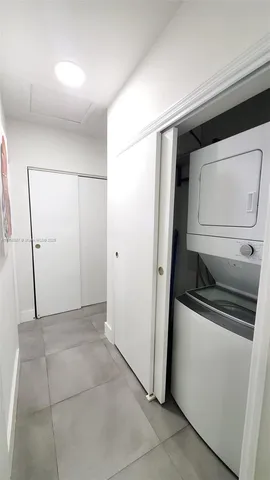 a view of a storage and utility room with closet