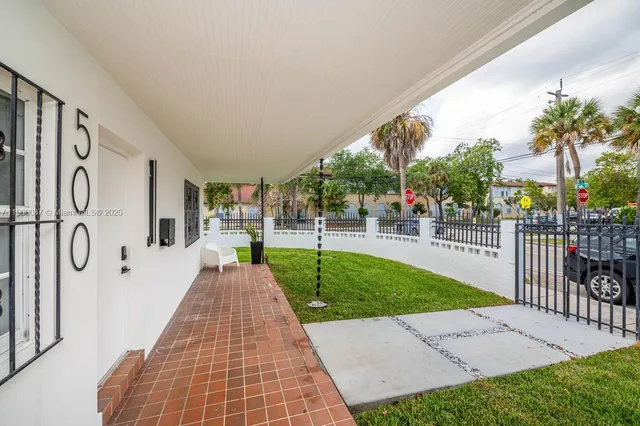a view of backyard with a small garden