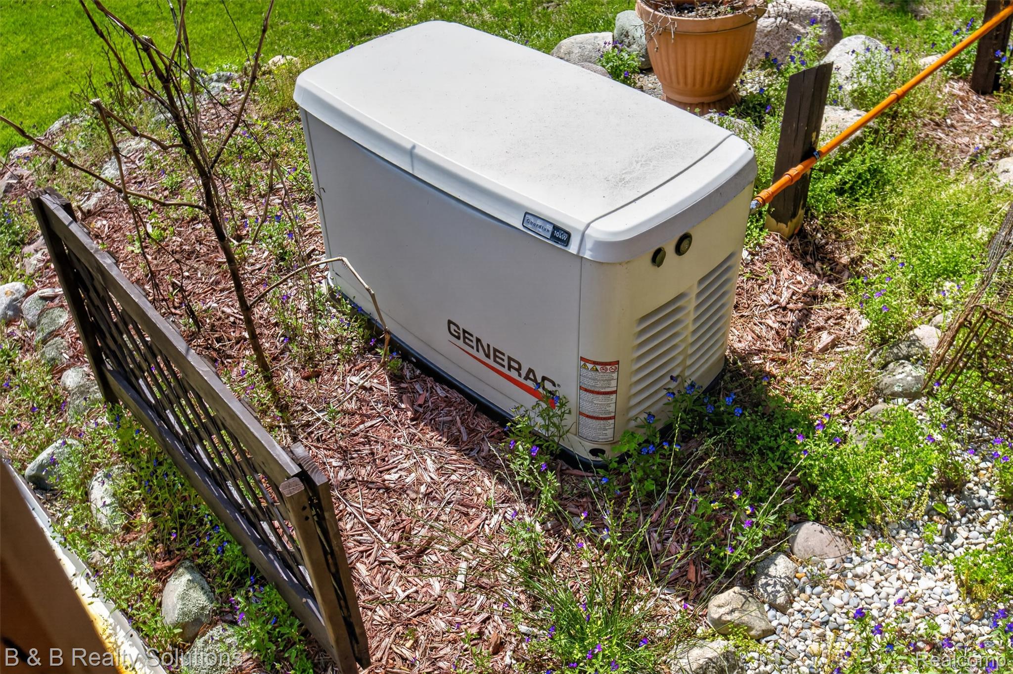 5544 Piersonville Road Columbiaville, MI 48421 - Photo 40 of 49 Outdoor Generac whole-house generator unit
