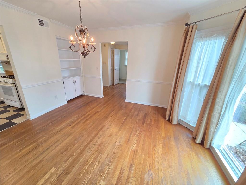 8 Old Decatur Circle Decatur, GA 30030 - Photo 12 of 27 a view of a room with wooden floor and staircase