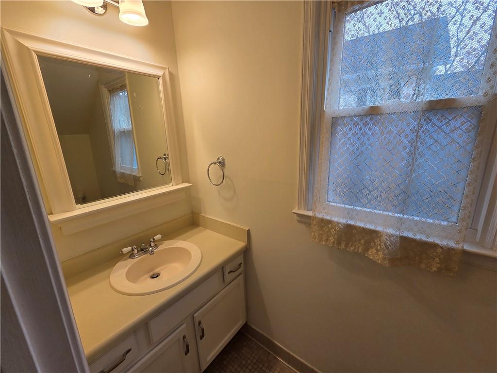 8 Old Decatur Circle Decatur, GA 30030 - Photo 15 of 27 a bathroom with a sink and mirror