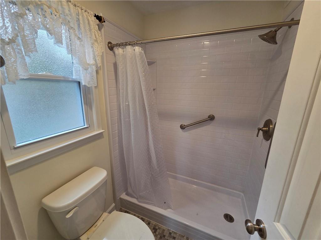8 Old Decatur Circle Decatur, GA 30030 - Photo 25 of 27 a bathroom with a shower and a toilet