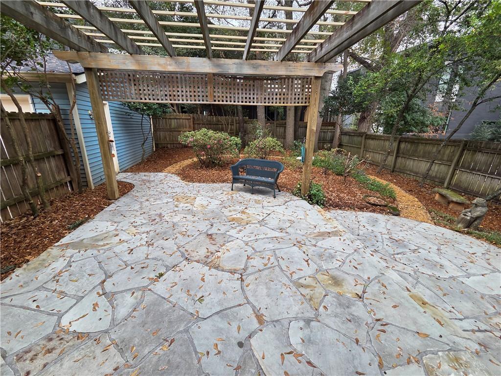 8 Old Decatur Circle Decatur, GA 30030 - Photo 27 of 27 a view of a porch with furniture and a yard