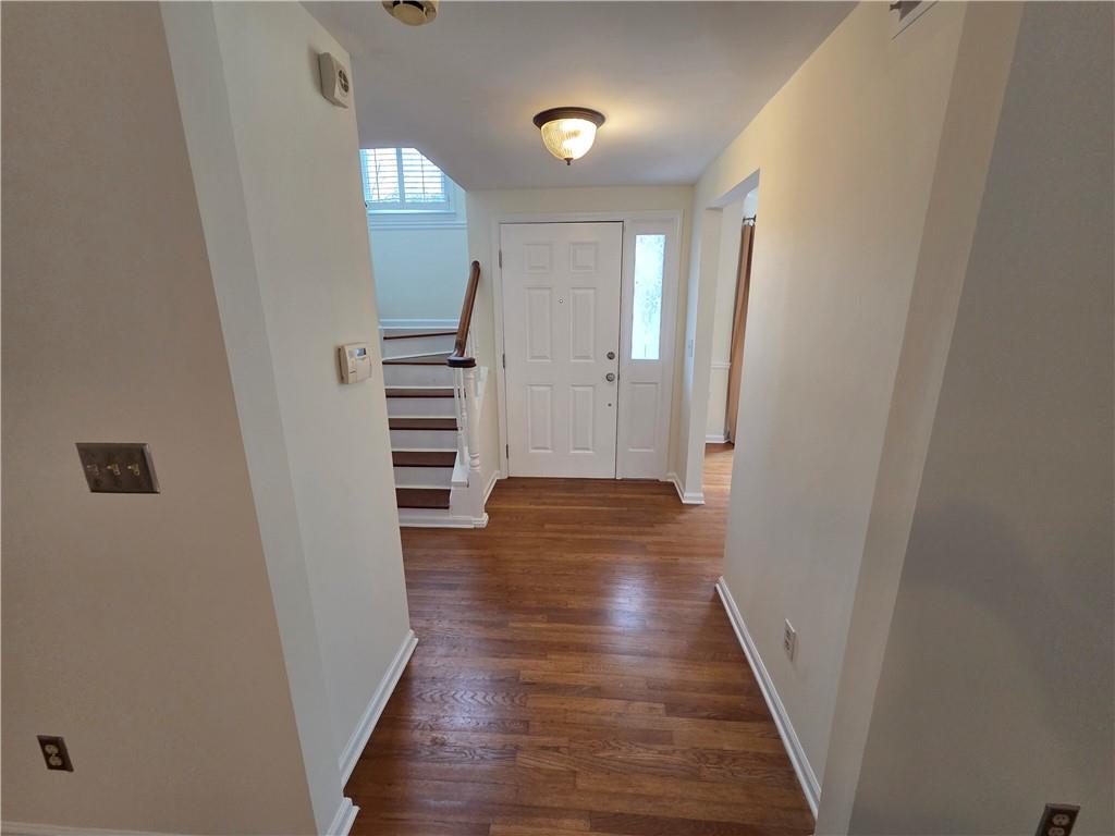 8 Old Decatur Circle Decatur, GA 30030 - Photo 3 of 27 an empty room with wooden floor and staircase