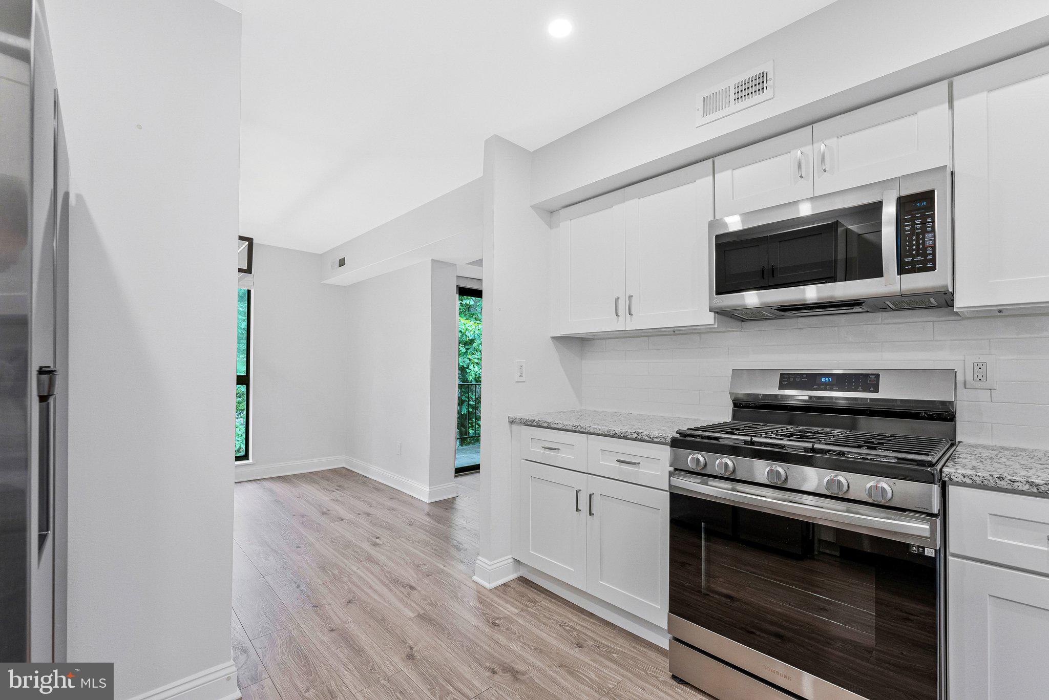 2012 Colts Neck Road, Unit 21A Reston, VA 20191 - Photo 8 of 44 Updated white kitchen with SS appliances.
