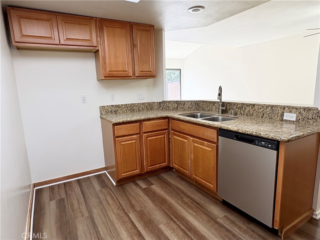 18223 Soledad Canyon Road, Unit 29 Canyon Country, CA 91387 - Photo 5 of 23 a kitchen with stainless steel appliances granite countertop a sink stove and cabinets
