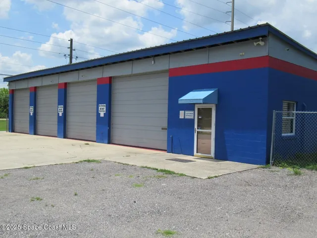 a view of a house with a garage