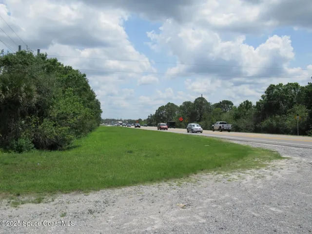 a view of yard with small swimming pool