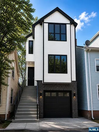 a front view of a house with a garage