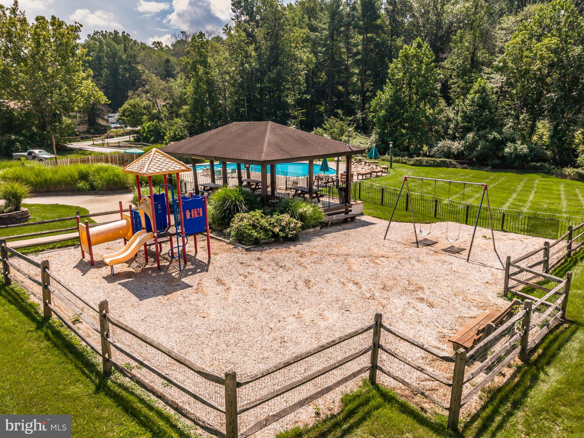 1210 Painters Crossing, Unit 1210 Chadds Ford, PA 19317 - Photo 16 of 18 swimming pool view with a seating space