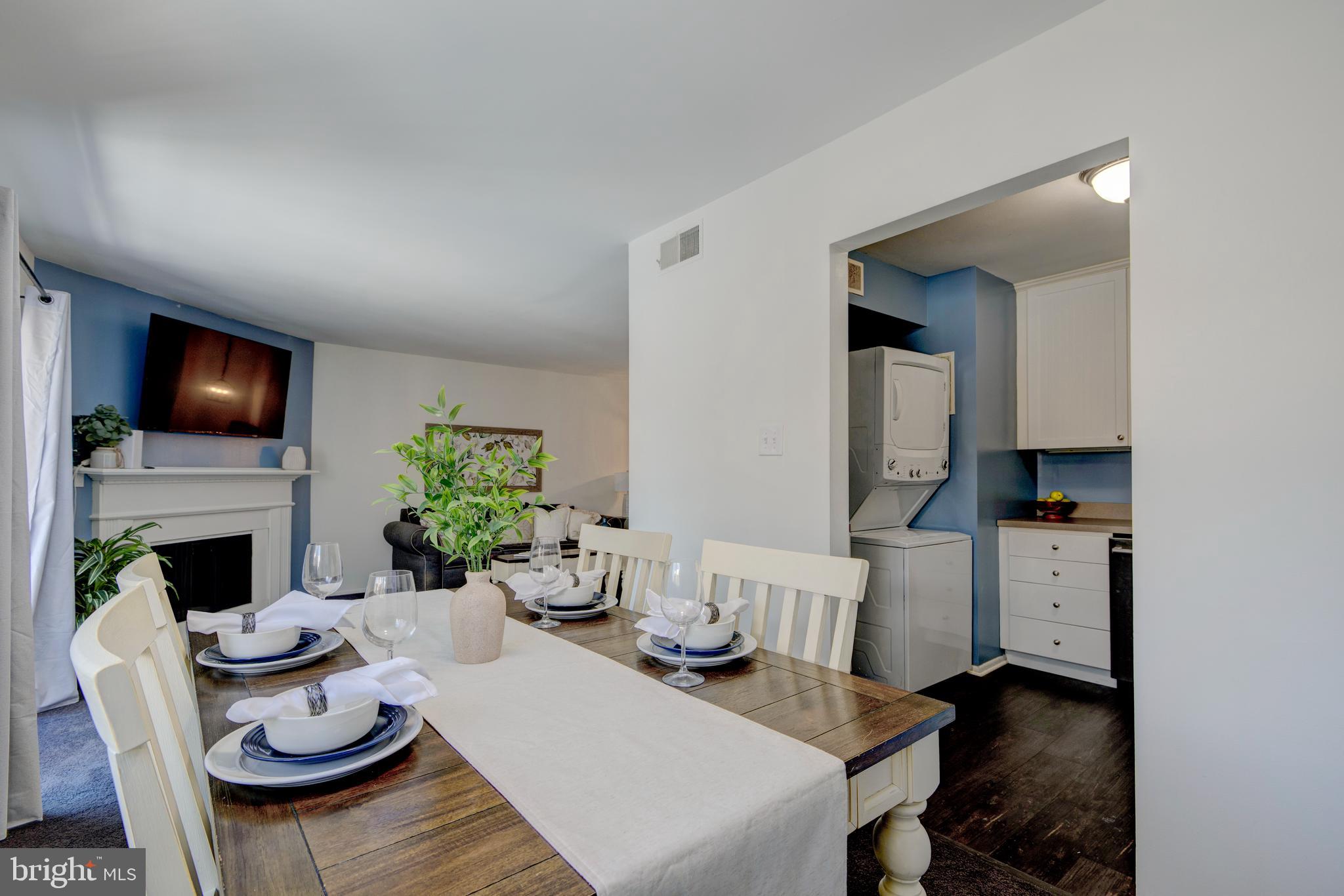 1210 Painters Crossing, Unit 1210 Chadds Ford, PA 19317 - Photo 6 of 18 a living room with furniture and a fireplace