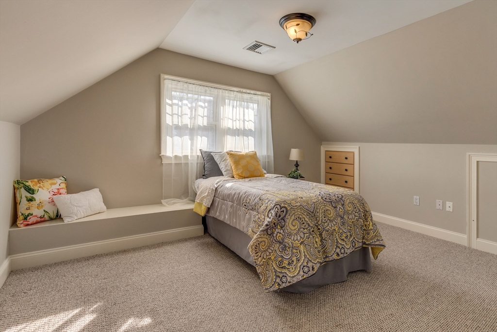 2 Melvin Street, Unit 2 Wakefield, MA 01880 - Photo 14 of 17 a spacious bedroom with a bed and a window