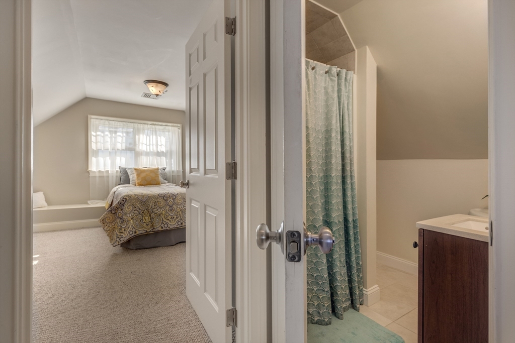 2 Melvin Street, Unit 2 Wakefield, MA 01880 - Photo 15 of 17 a bedroom with a bed and a window