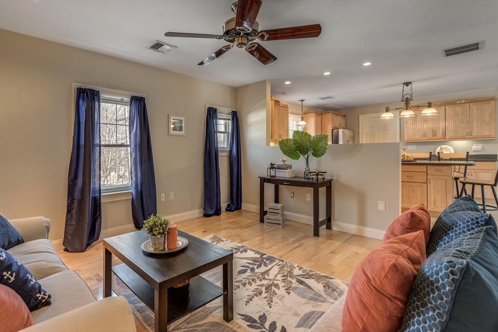 2 Melvin Street, Unit 2 Wakefield, MA 01880 - Photo 7 of 17 a living room with furniture and a table