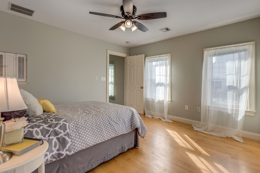 2 Melvin Street, Unit 2 Wakefield, MA 01880 - Photo 10 of 17 a bedroom with a bed and window